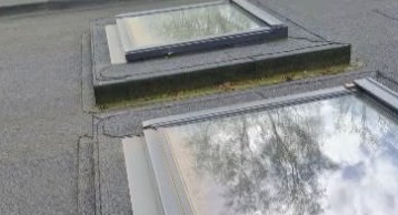 Dakramen op een plat dak tijdens een realisatie van DRD Dienstverlening.